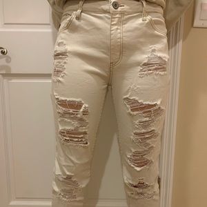Distressed white jeans